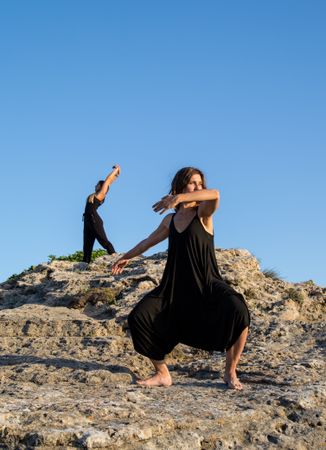Women dancing near stones