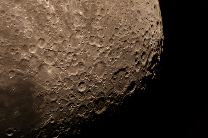 Magnified crater region revealing scattered lunar pits and ridges