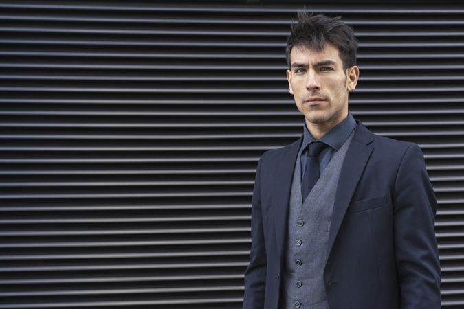 Front view of an executive man wearing a suit while looking at camera