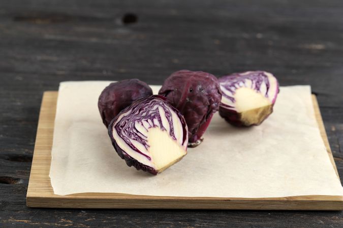 Small Red Cabbage on Brown Chopping Board