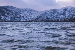 Shore with mountains near water