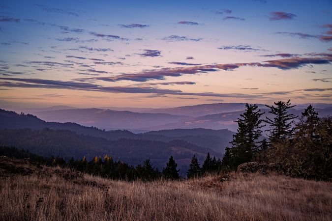 Blue to peach gradient sunset in the mountains