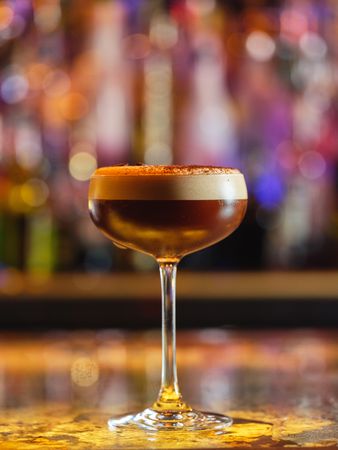 Frothy espresso martini cocktail in bar