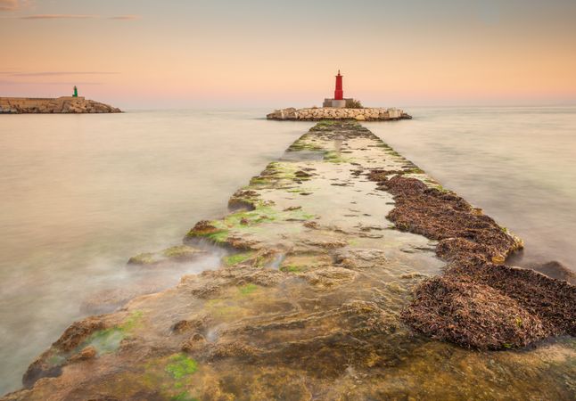 Rough path to islet with lighthouse