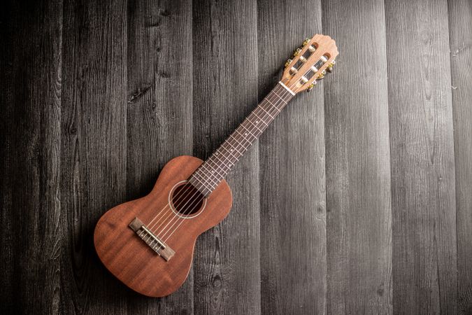 Ukulele on wooden tabletop