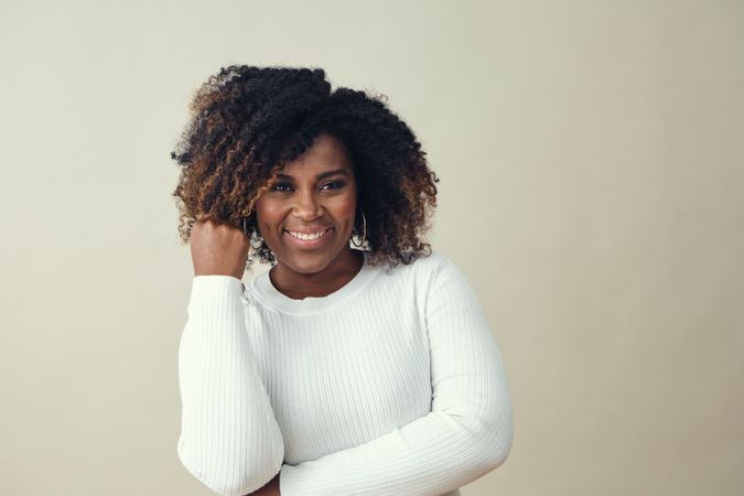 Black woman with one fist up in triumph