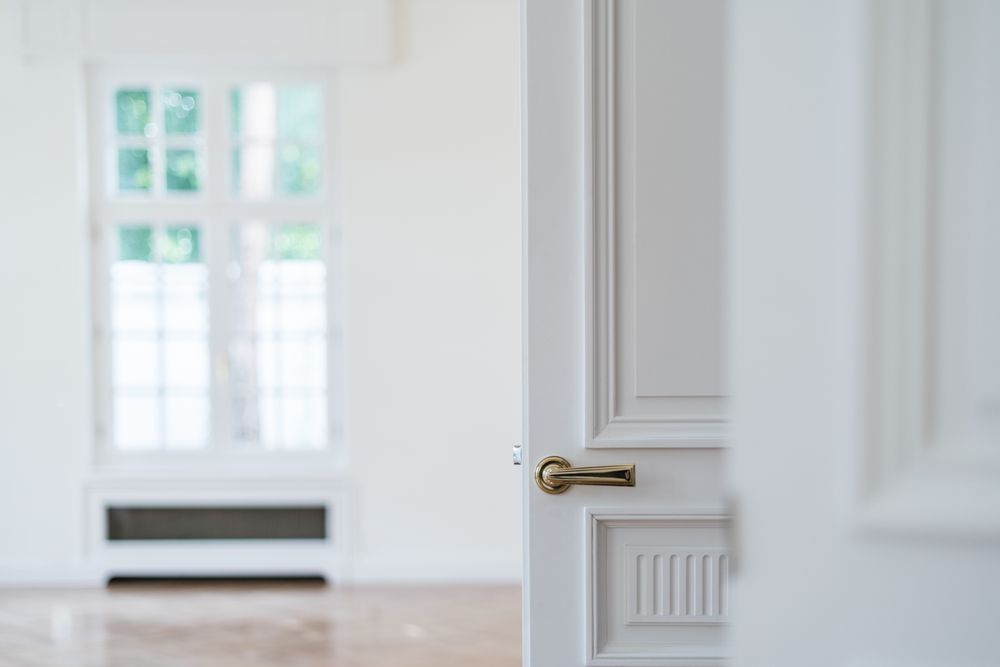 Modern door with stylish metal knob in flat
