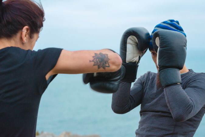 Boxers exercising on cliff