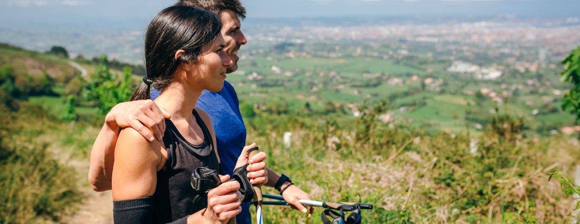 Couple stopping to look the views while doing trail
