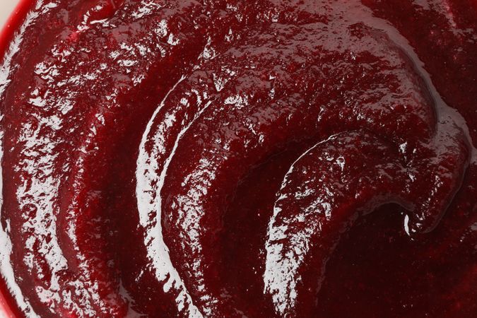 Close up of dark red beetroot or borscht soup