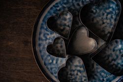 Heart shaped cookie cutters on plate