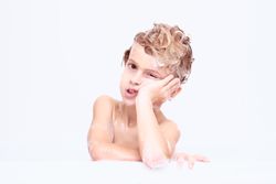 Bored boy with soapy head