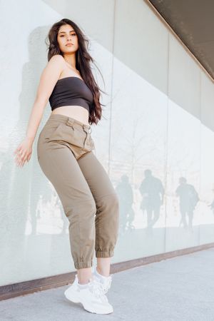 female standing near wall