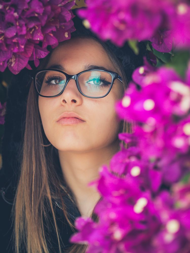 Woman on background of stunning violet flowers