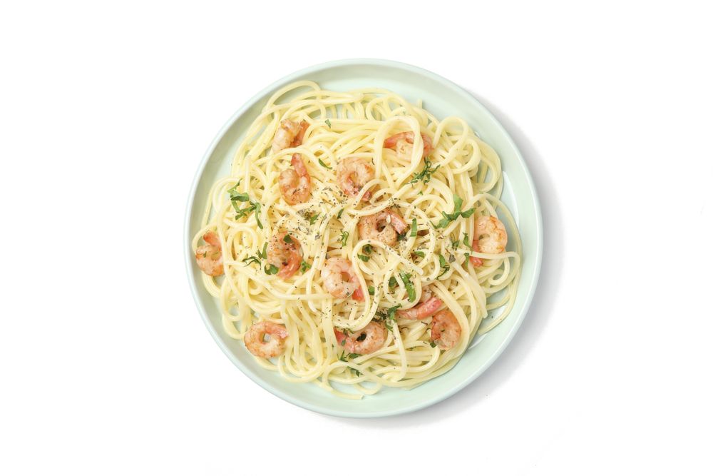 Plate with tasty pasta isolated on plain background