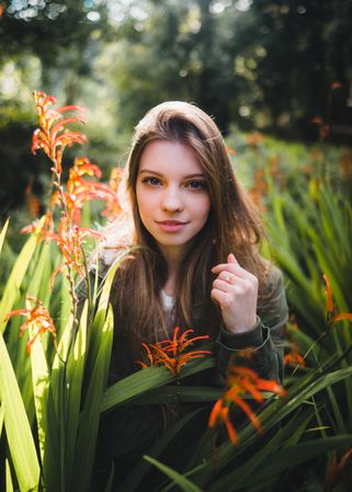 Young woman standing in meadow