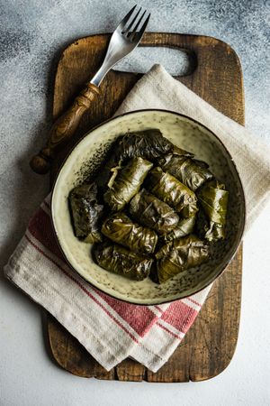 Top view of bowl of stuffed grape leaves