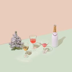 Christmas tree with champagne bottle and glasses