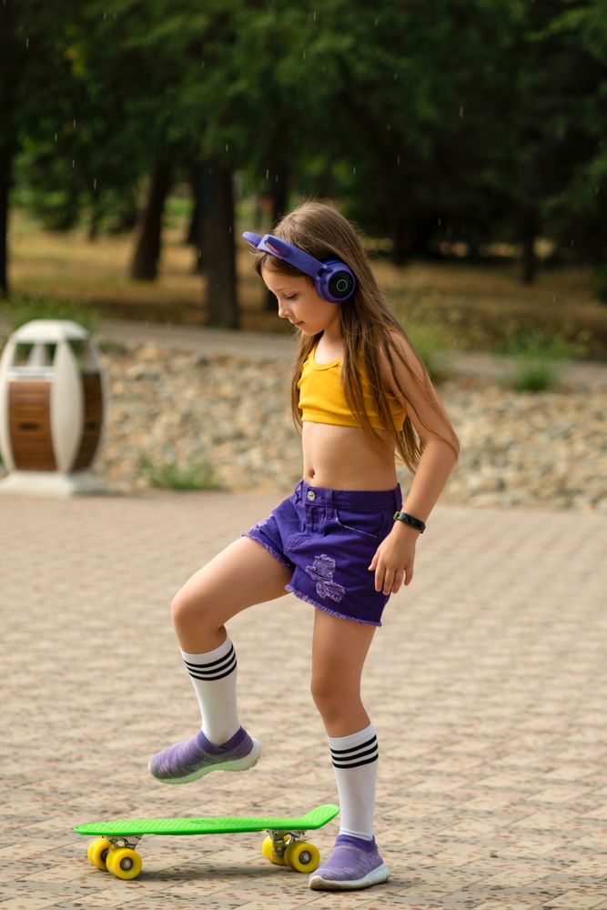 Girl playing on Skateboard