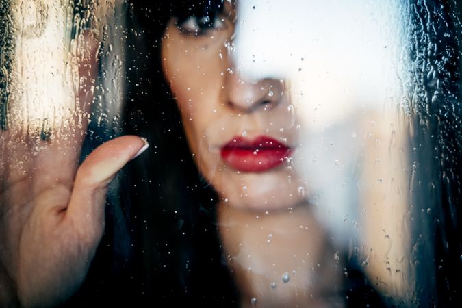 Stylish woman kissing glass