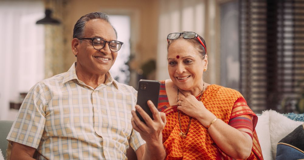 Couple Using Smartphone for Video Call at Home