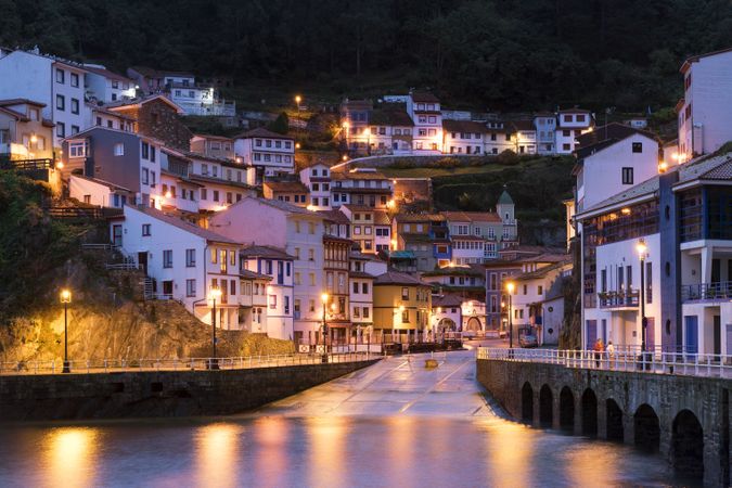 Glowing city with harbor in night time