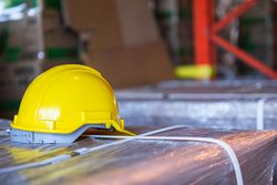 Hard hat resting on product in warehouse