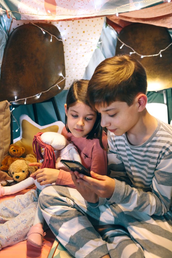 Children watching unsafe content on cellphone without parental supervision at home