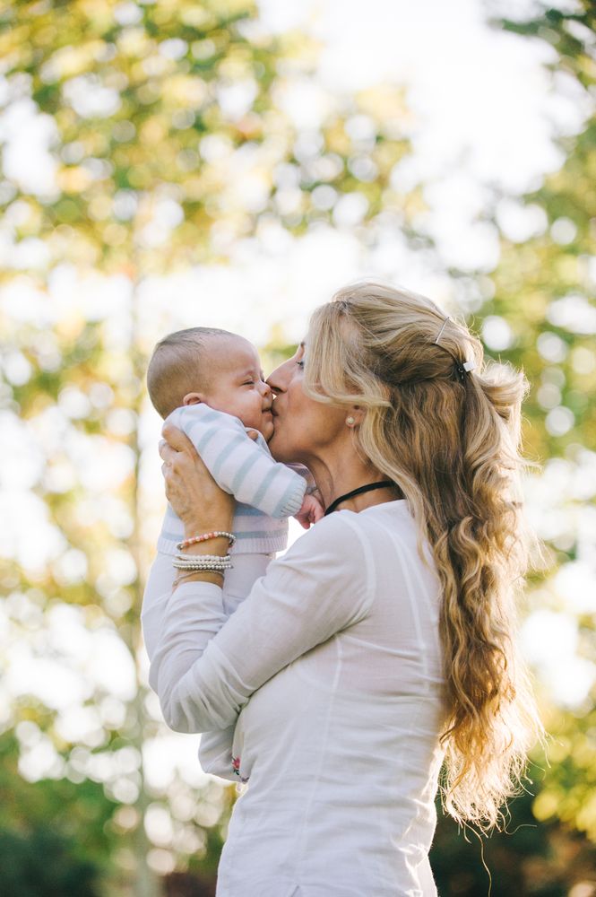 grandmother holding her grandson with down syndrome