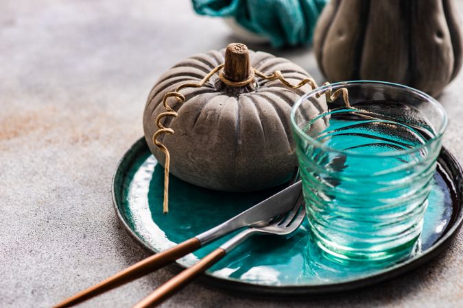 Ceramic pumpkin decorations with teal tableware