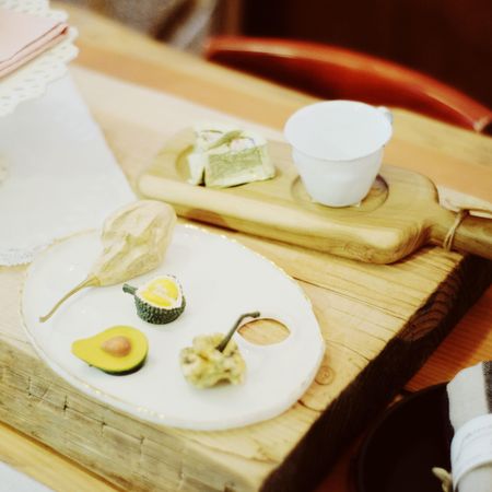 Dried fruits on wooden tray on a table