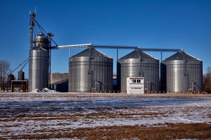 A row of metal grain silos outside Dowagiac, Michigan
