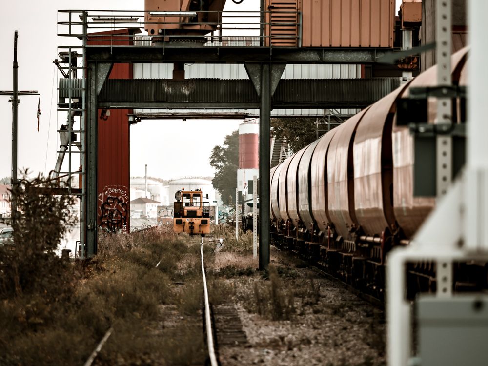 Semaphores. Railway tracks, wagons, Port cranes.