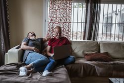 Gay couple with computer