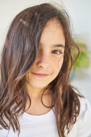 Charming girl with long brown hair