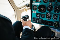 Pilot holding controller flying an airplane 56zWY5