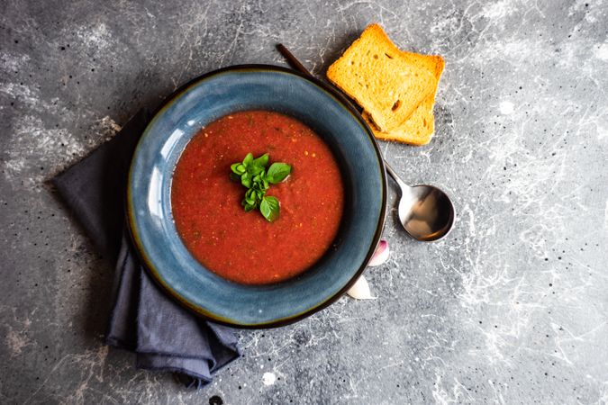Tomato cream soup with garnish & toast