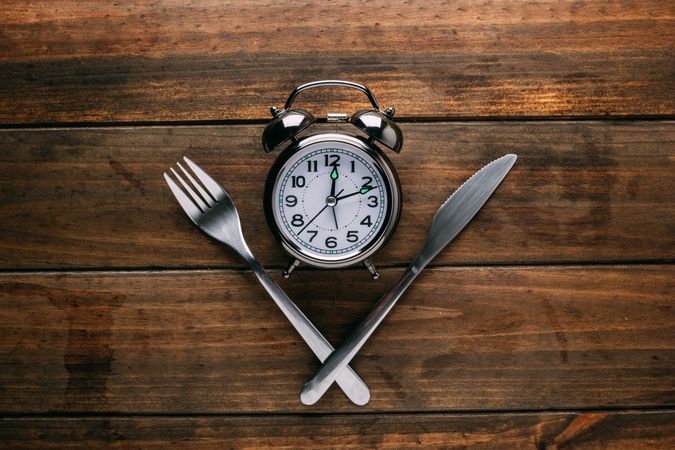 Cutlery near alarm clock