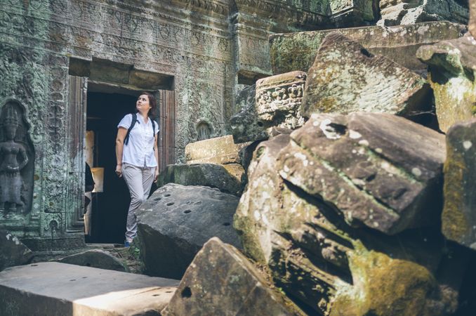 Female tourist looking at old temple
