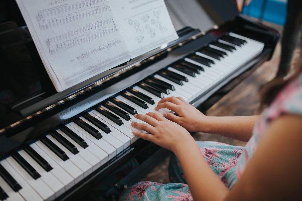 Student playing the piano at band practice