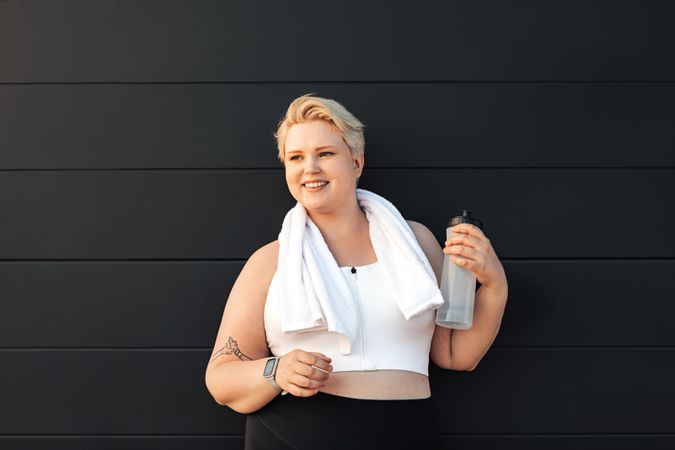 Curvy blond woman resting after an exercise