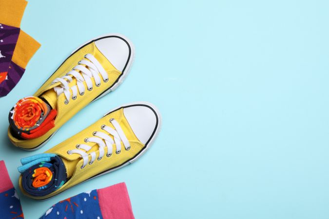 Casual clothes and wearing concept - socks, clothes for foot