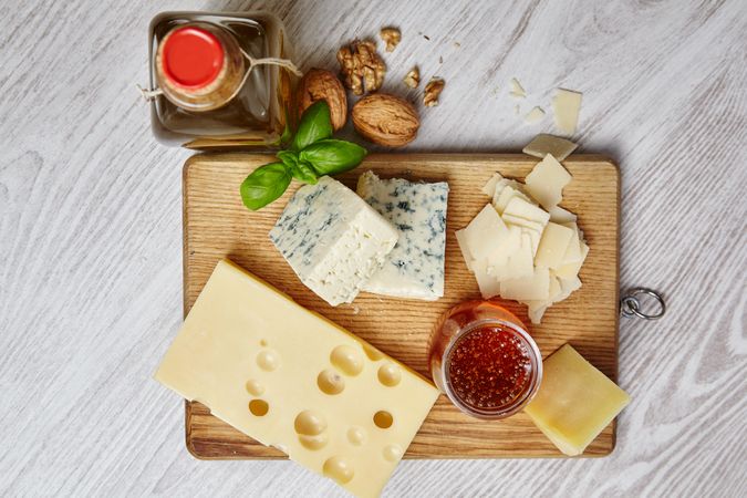 Top view of cheese plate on wooden board