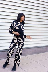 Modern dancer gesturing standing on street