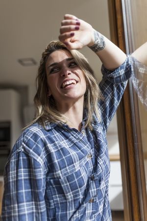 Woman at home near a windows