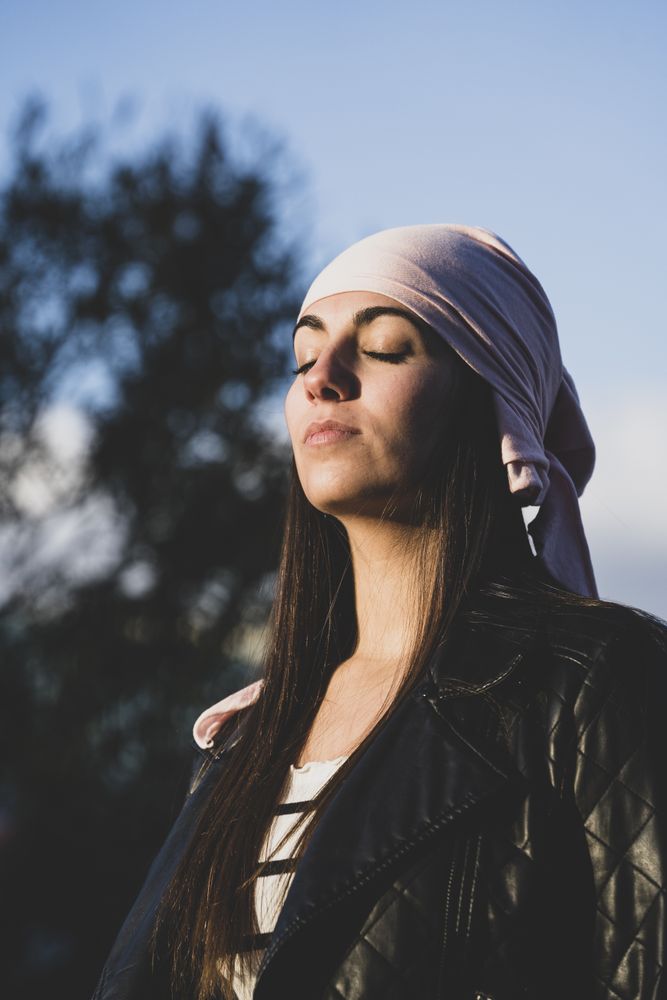 Young woman with cancer bandana
