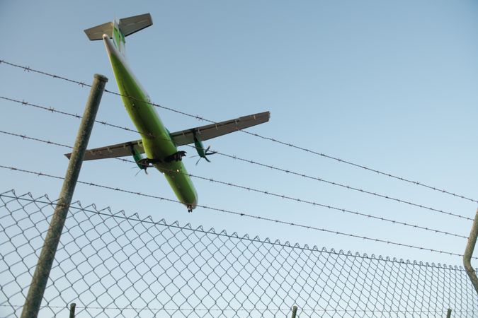 Plane behind security fence
