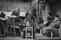 Grayscale photo of indigenous women taking an English class offered by an NGO 5rK174