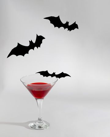 Red blood cocktail with bats for halloween