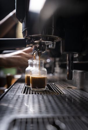 Barista using coffee machine